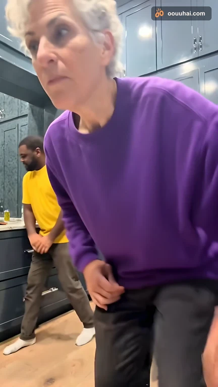 Two AI-generated people doing the Wipe Me Down dance in a kitchen