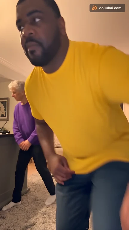 Two AI-generated people doing the Wipe Me Down dance in a cozy living room